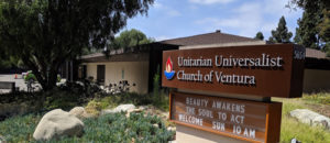 Sign for the Unitarian Universalist Church of Ventura with the building behind it